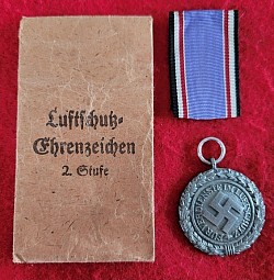 Nazi Luftschutz Honor Medal with Numbered Ring and Issue Envelope...$125 SOLD